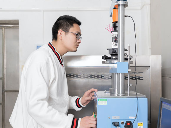 Technicians using automatic machines inside the factory