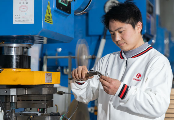 Staff is measuring the incoming material in the factory